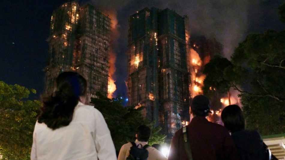'Very worried': Hong Kong fire survivors hunt for the missing