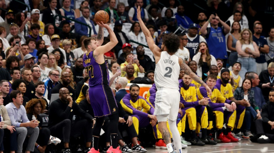 Tearful Doncic scores 45 on return to Dallas as Lakers clinch playoff spot