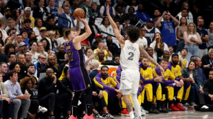 Tearful Doncic scores 45 on return to Dallas as Lakers clinch playoff spot
