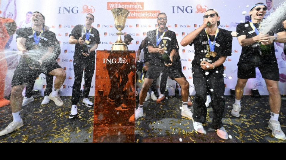 Schroder toasts 'crazy' fans as world champions return to Germany