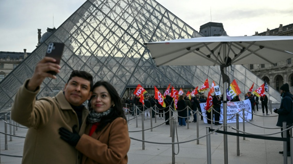 Hundreds queue at Louvre museum as strike vote delays opening
