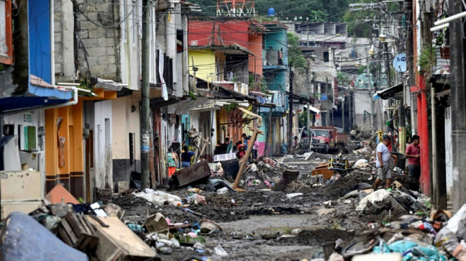 Flood-hit Mexican town digs out debris, fearing disease outbreaks