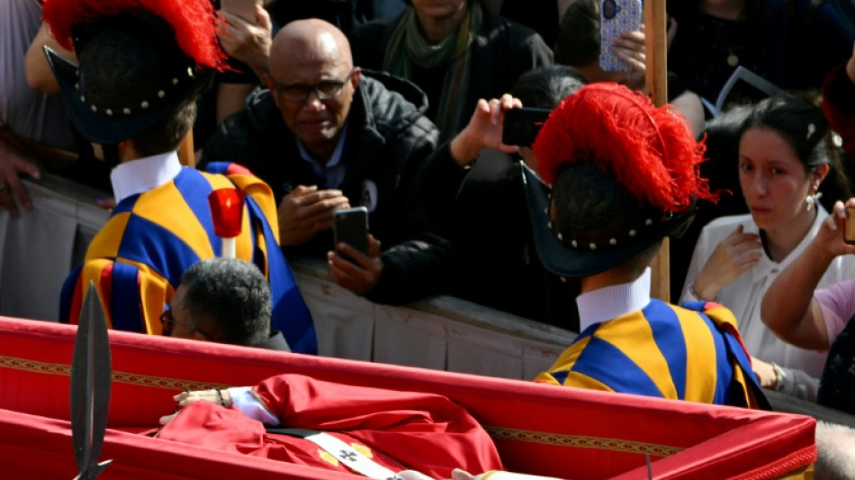 Pilgrims flock to pay tribute to pope lying in state
