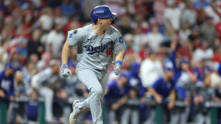 Dodgers hold off Phillies, Brewers on the brink