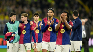 Barca suffer morale blow in Dortmund amid quadruple hunt